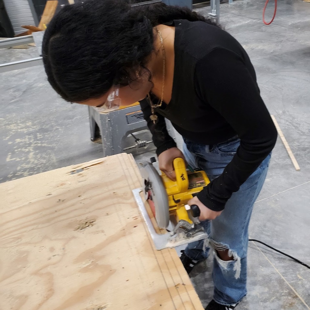 Student cutting wood
