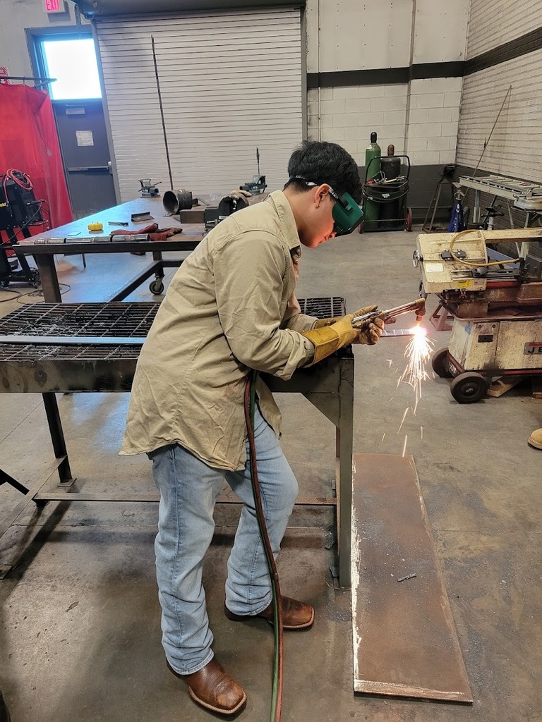 Student using the cutting torch