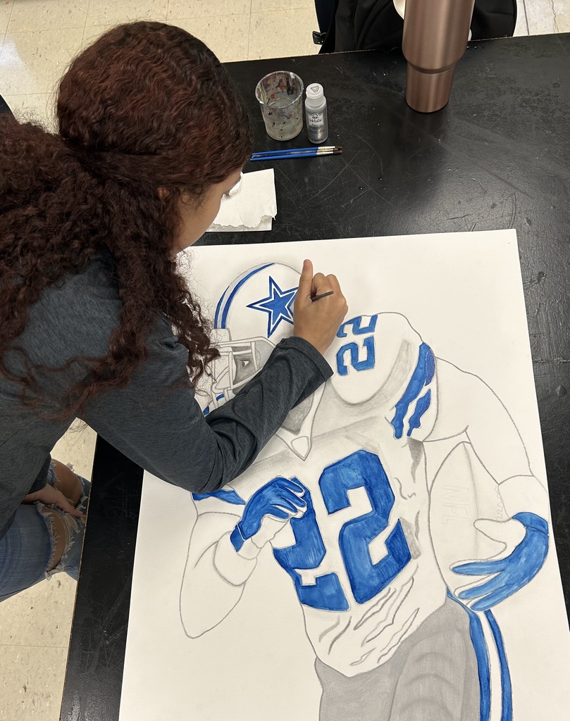 Student coloring in a portrait