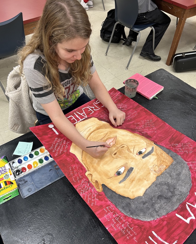 Student coloring a portrait