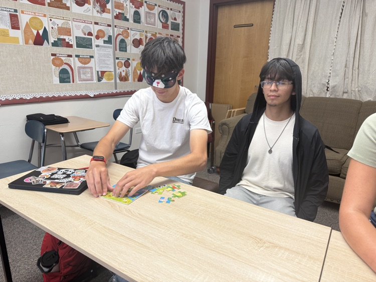 student doing puzzle