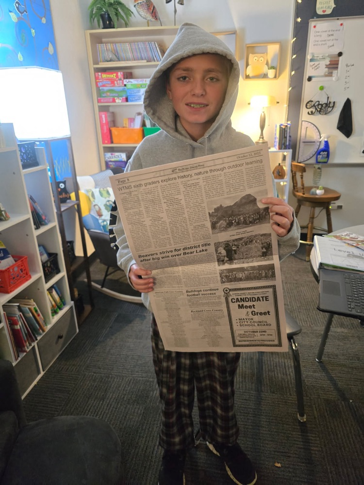 Ayden with his newspaper 