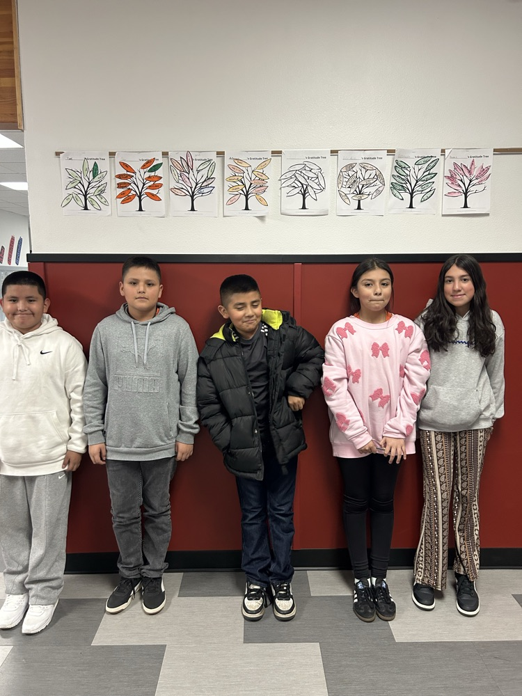 picture of students with Thankful trees