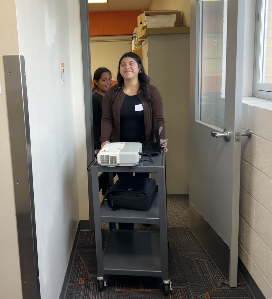 Yareli A. and Sophia C. coming out of their presentation 