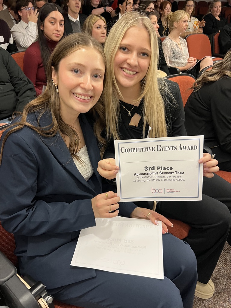 Kimber P. and Caetlyn W. recieving their award