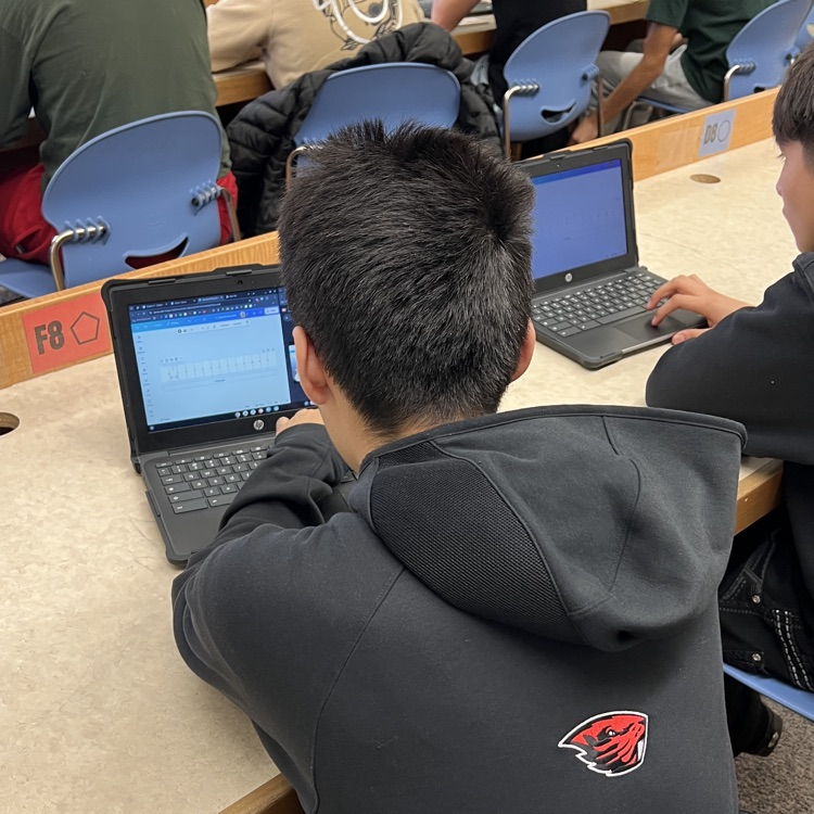 students working on designing their rulers