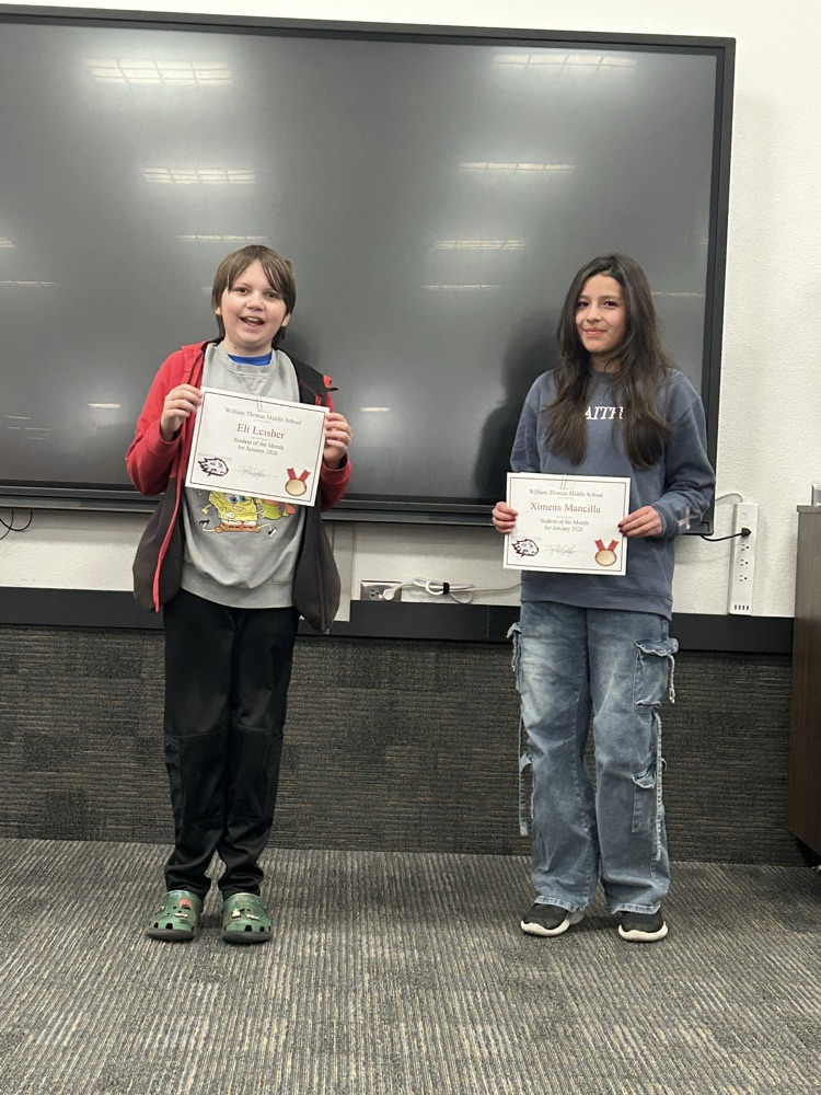 picture of students holding their student awards