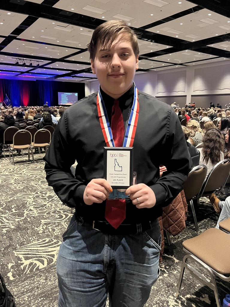 Adam C. coming off stage with his 4th place award