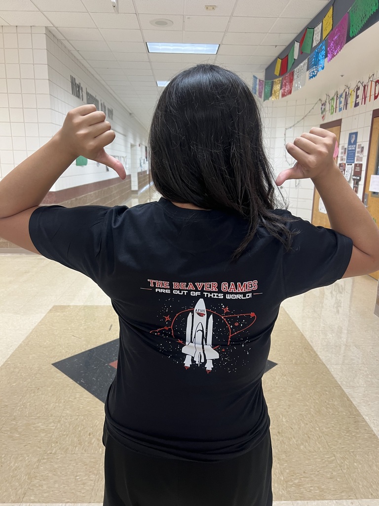 Valerie R. poses with a shirt. Back design
