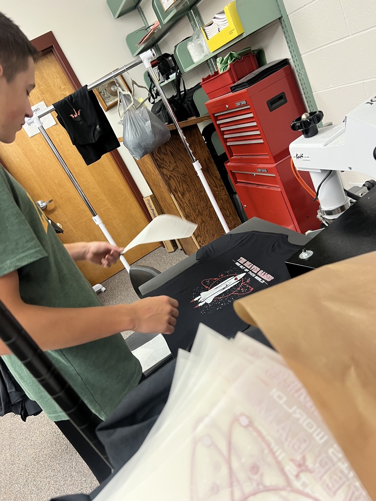 Blake S. and Valerie R. measure and press shirts for homecoming