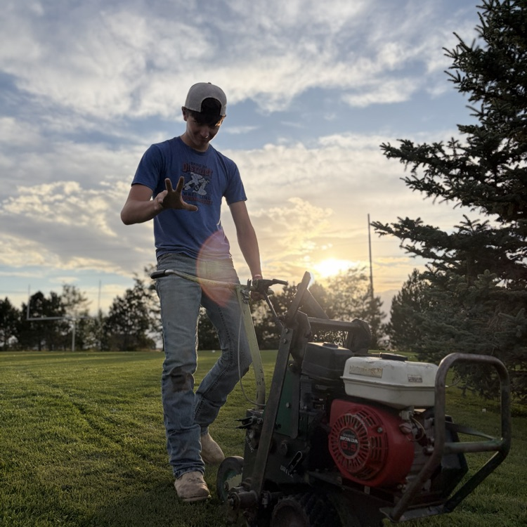 Travis cutting sod