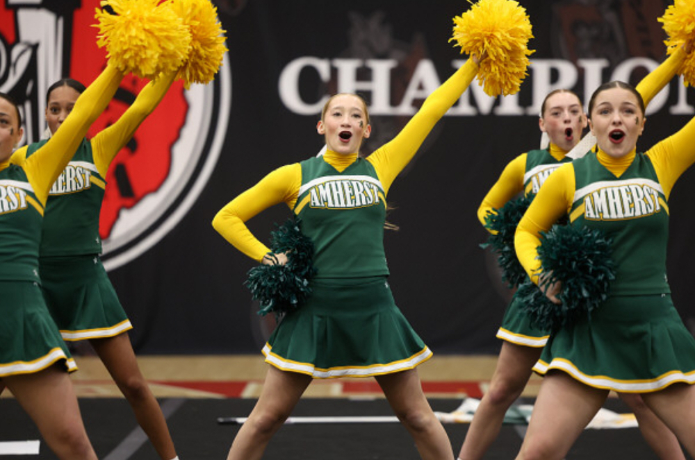 A action shot of Amherst Steele Cheer at State Competition