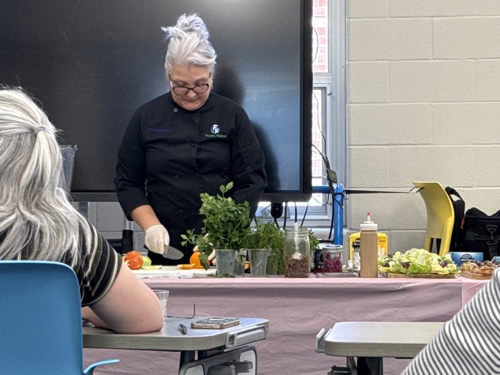 Yolanda Ramos giving a food demonstration during the "Heal Your Body with Food" class for Amherst staff. 