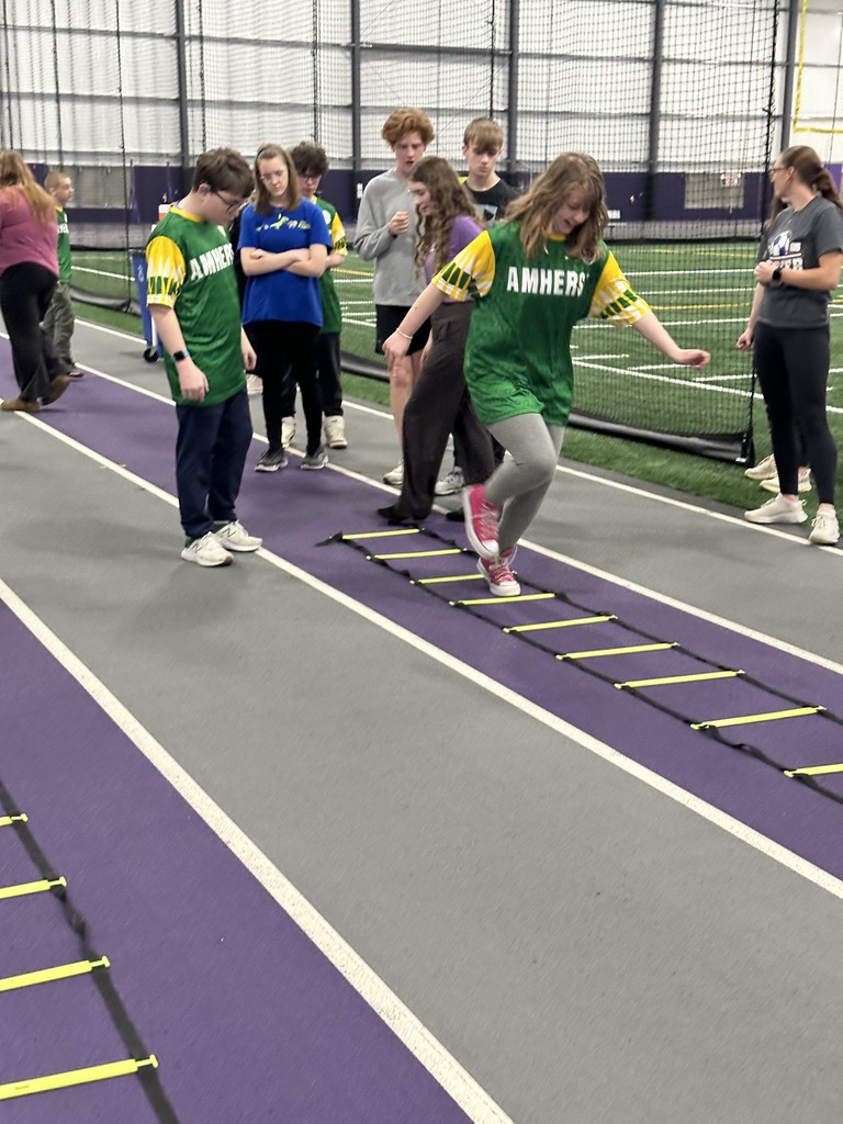 Amherst Special Olympics student participates in a skills challenge at Ashland University for a soccer training which involved running  a ladder drill 