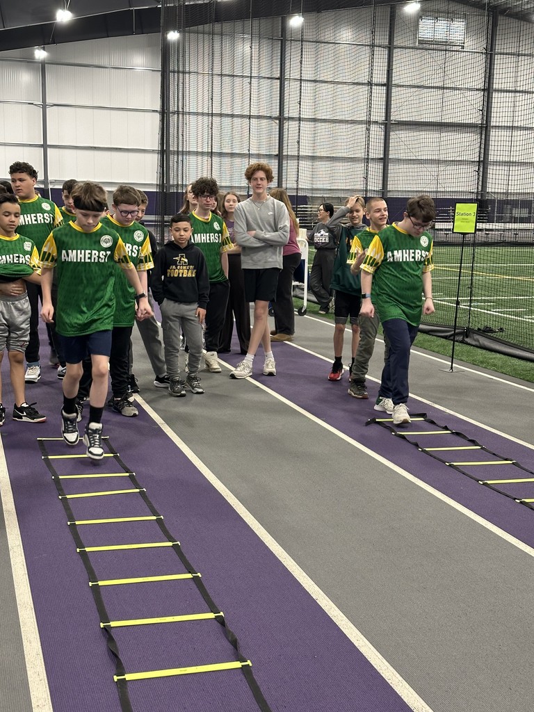 Amherst Special Olympics students participating in a relay ladder drill at Ashland University for a Soccer Training 