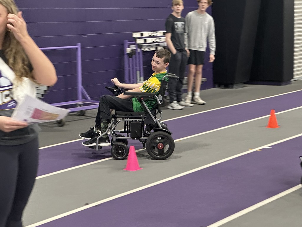 Amherst Special Olympics student participates in a skills challenge at Ashland University for a Soccer Training using his wheelchair to go in and out of cones
