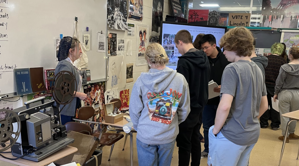 Students checking out artifacts from World War II: 