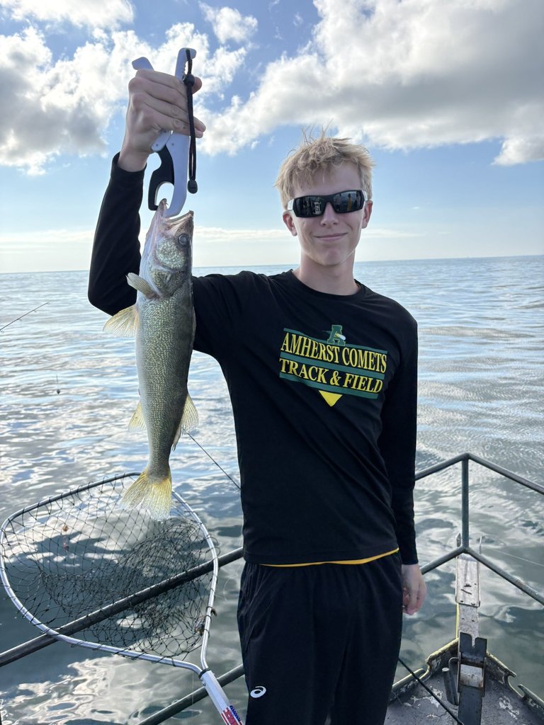 Student holding a fish 