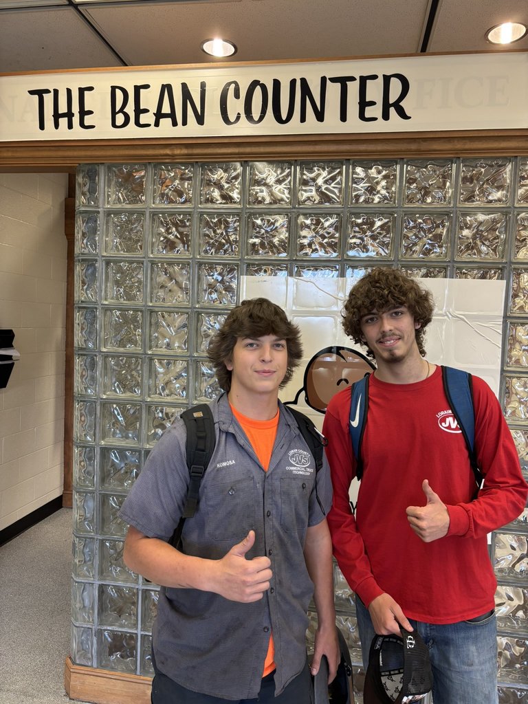 Two JVS students giving a thumbs up