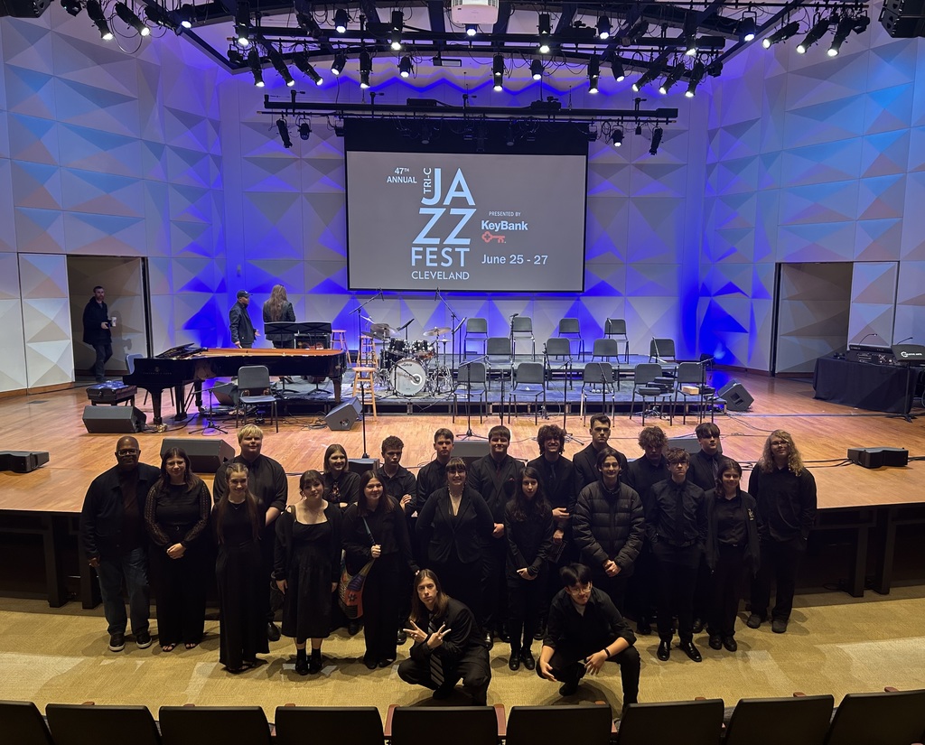 Jazz Students taking a picture in front of the stage