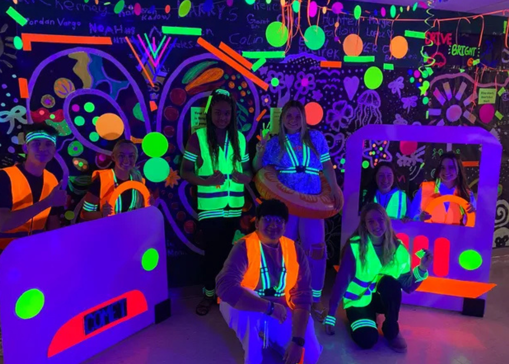 Students in neon vest promoting the Stay Bright and Drive Right Campaign