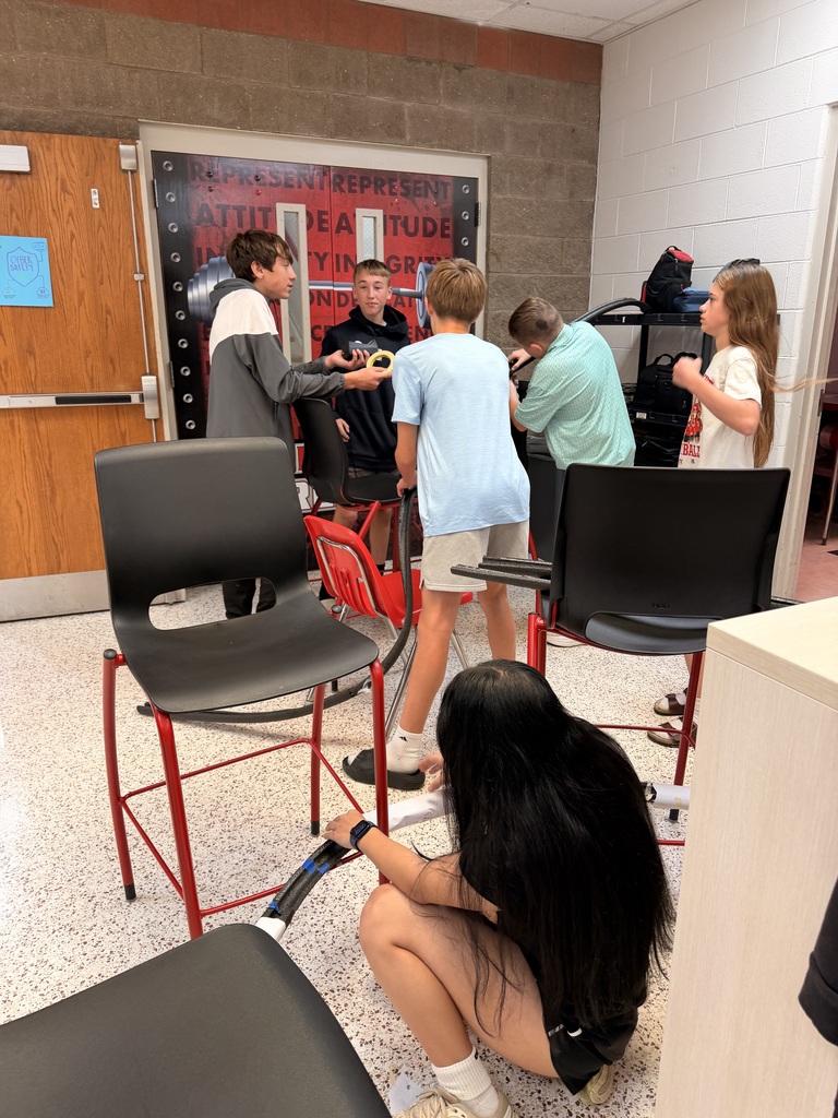 Students work on a roller coaster lab