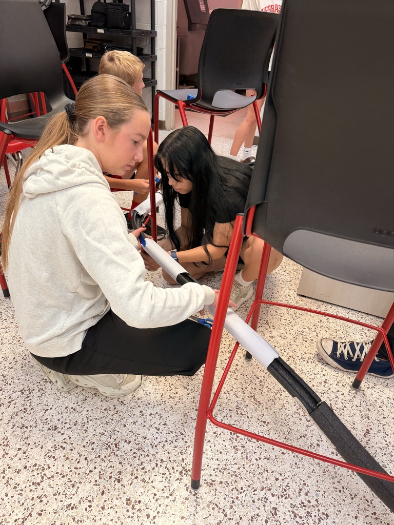 Students work on a roller coaster lab