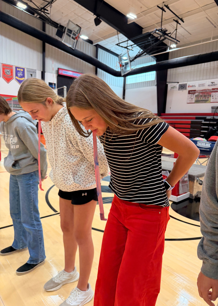 Students play a game at a pep rally
