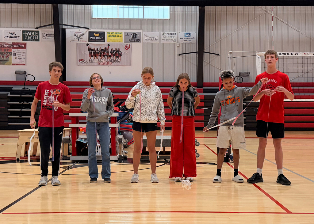 Students play a game at a pep rally