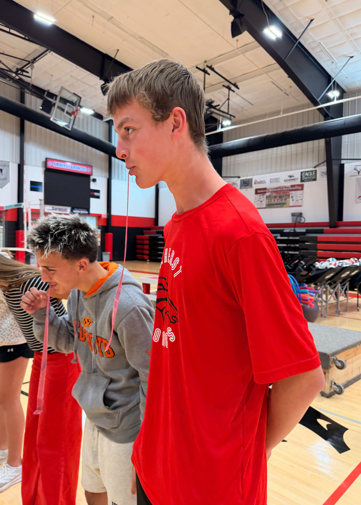 Students play a game at a pep rally