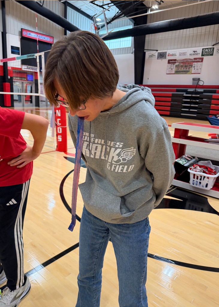 Students play a game at a pep rally