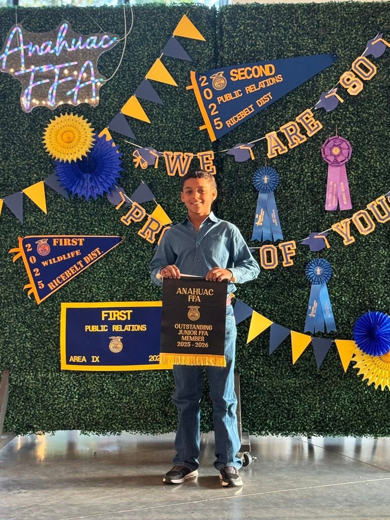 Student holding rewards from the Junior FFA banquet