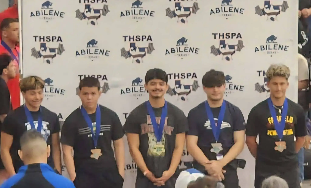 Martin Pereyda (center) wins the GOLD in the 148 weight class.