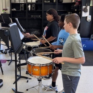 The 7th grade band is hard at work fine-tuning the little things—tone and musicianship