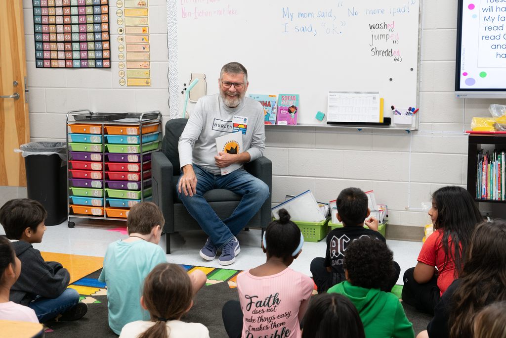 Real Men Read - Class photo listening to book by Mr. Hart