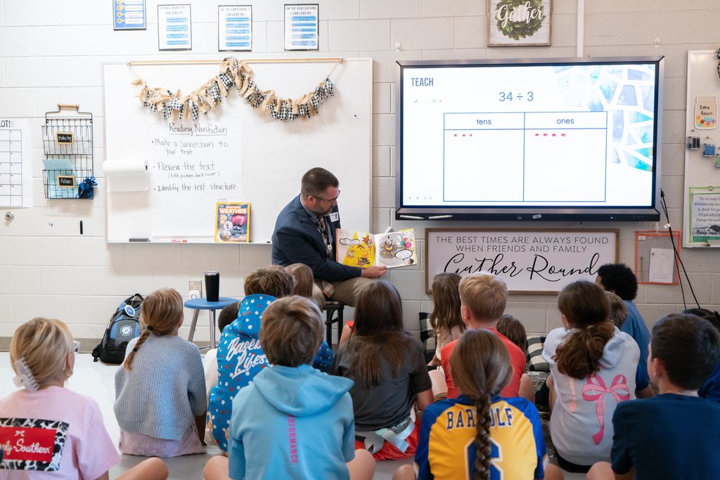Dr Young reading to Mrs. Phillips 4th grade class