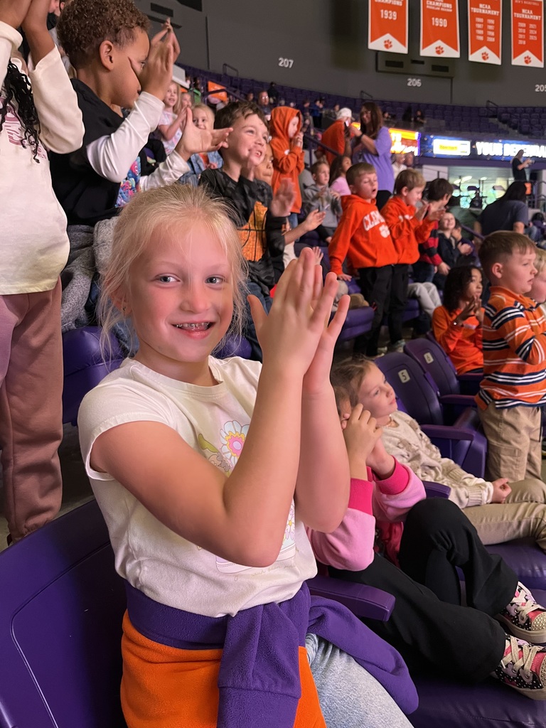 first grade girl cheering on the tigers!