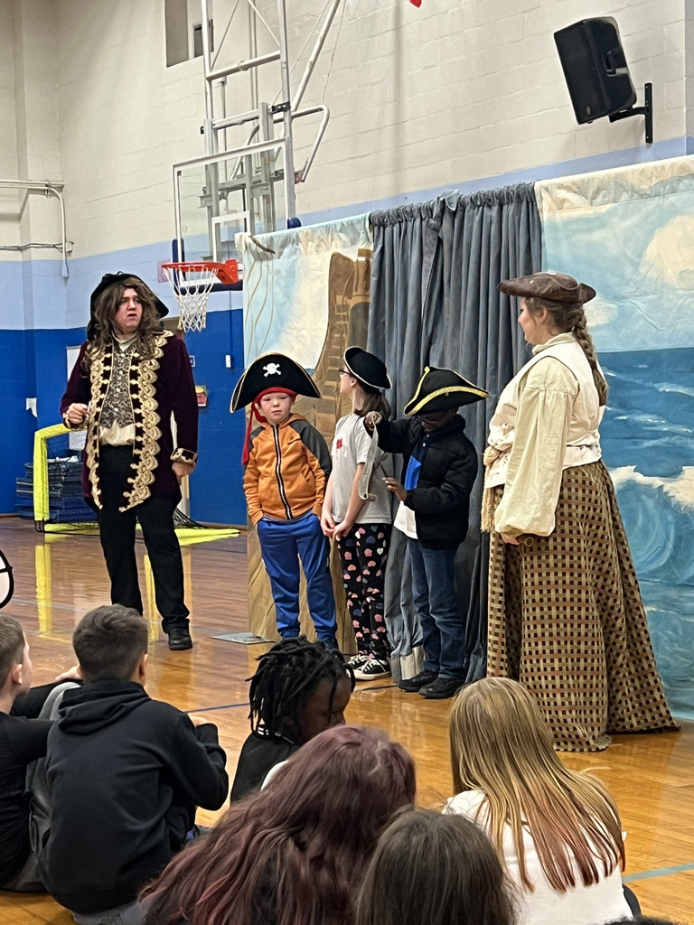  students with actors acting out skits