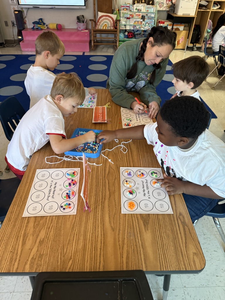 Mrs James doing small group work at table