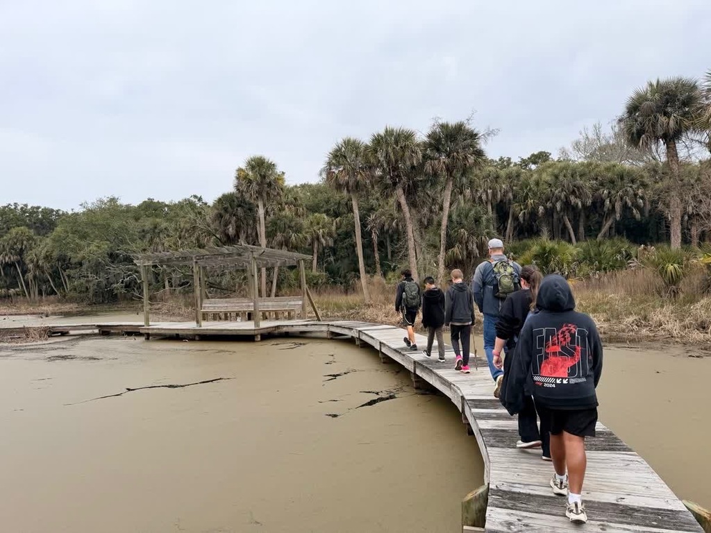 A boy group walking on the dock to explore