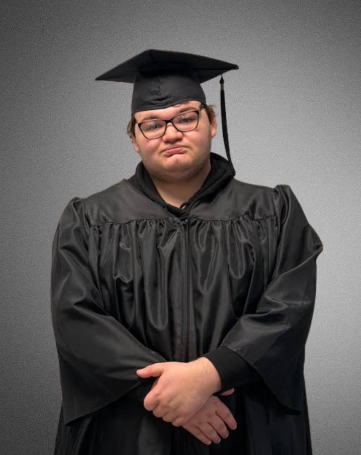 a student posing for a picture in graduation cap and gown