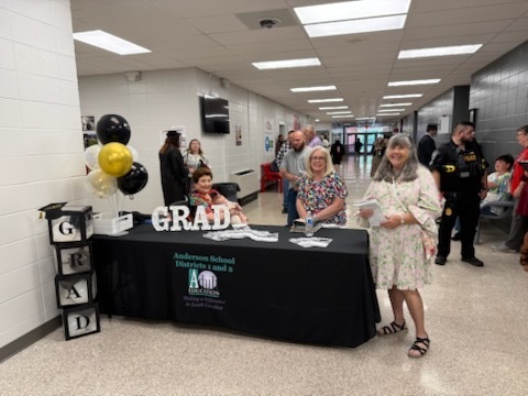 picture of the table with the graduation programs laying on it