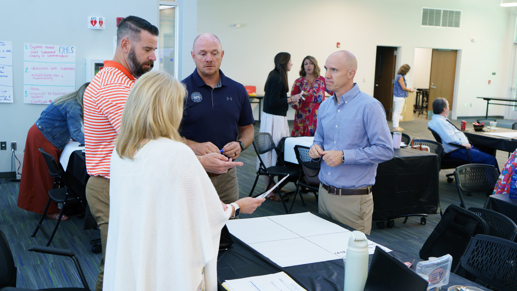 Staff members collaborate and map out their vision for the upcoming school year as they talk together
