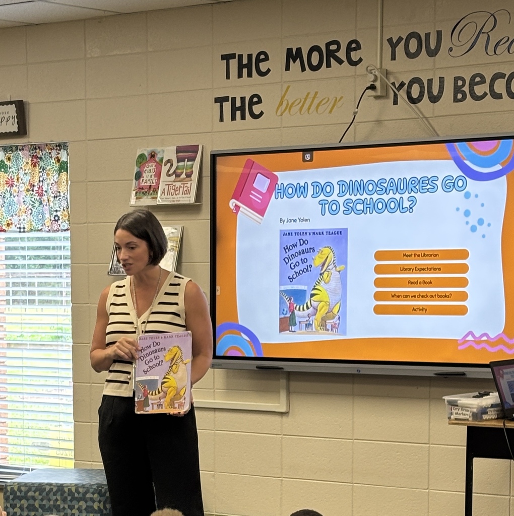 Mrs. Epling reading a library book to staff
