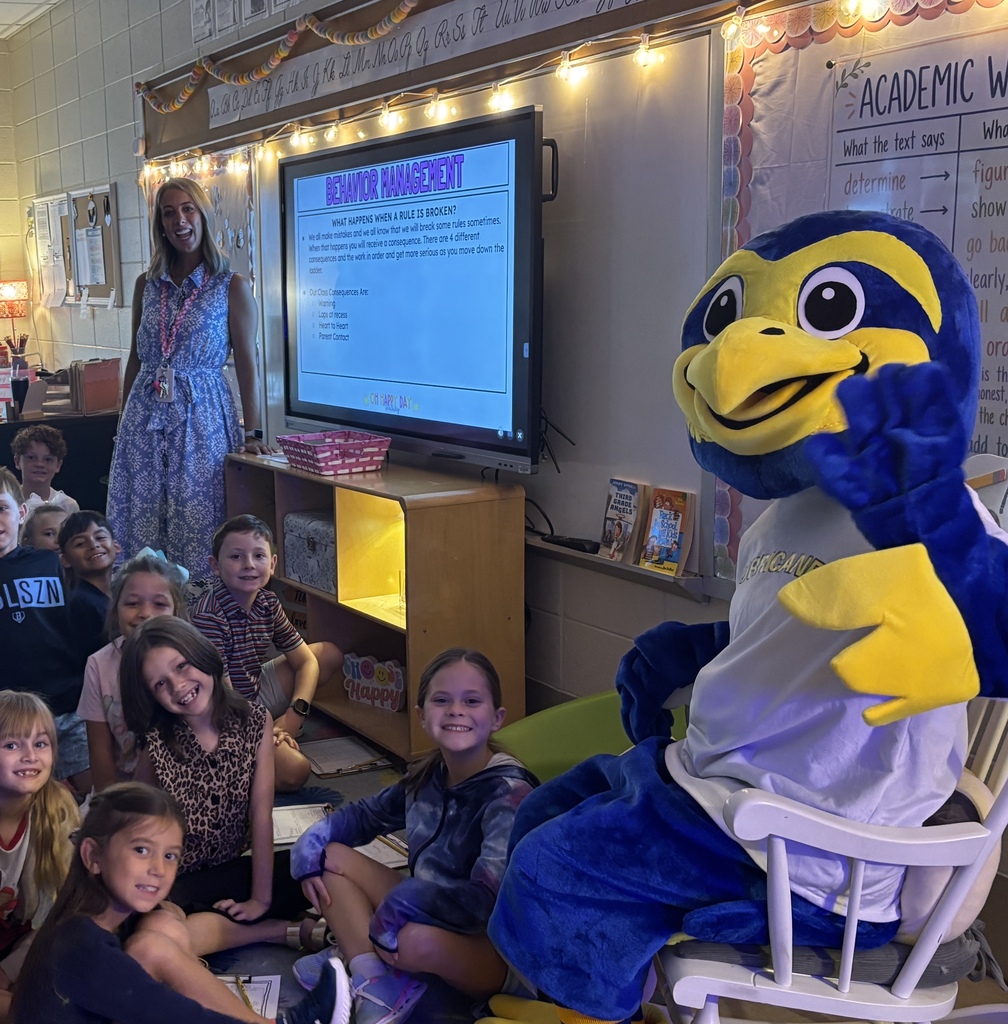 The new mascot visiting with students on the first day of school.
