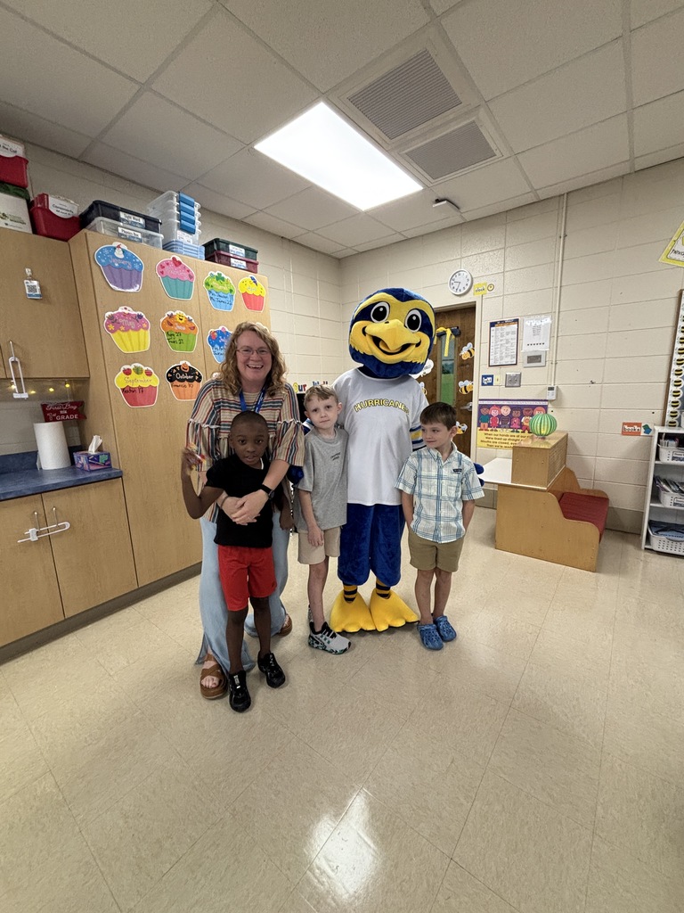 Mascot with teacher and students