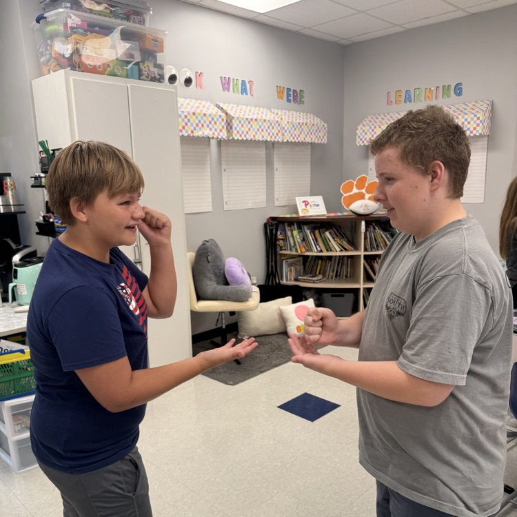 students playing rock paper scissors
