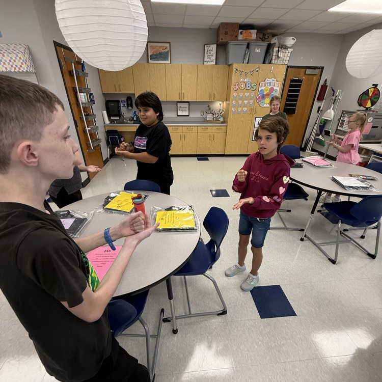 students playing rock paper scissors