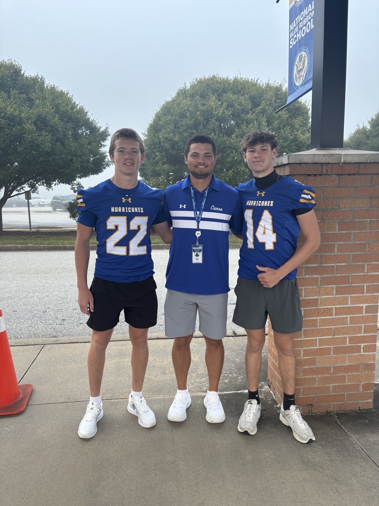 Football players with Coach Black