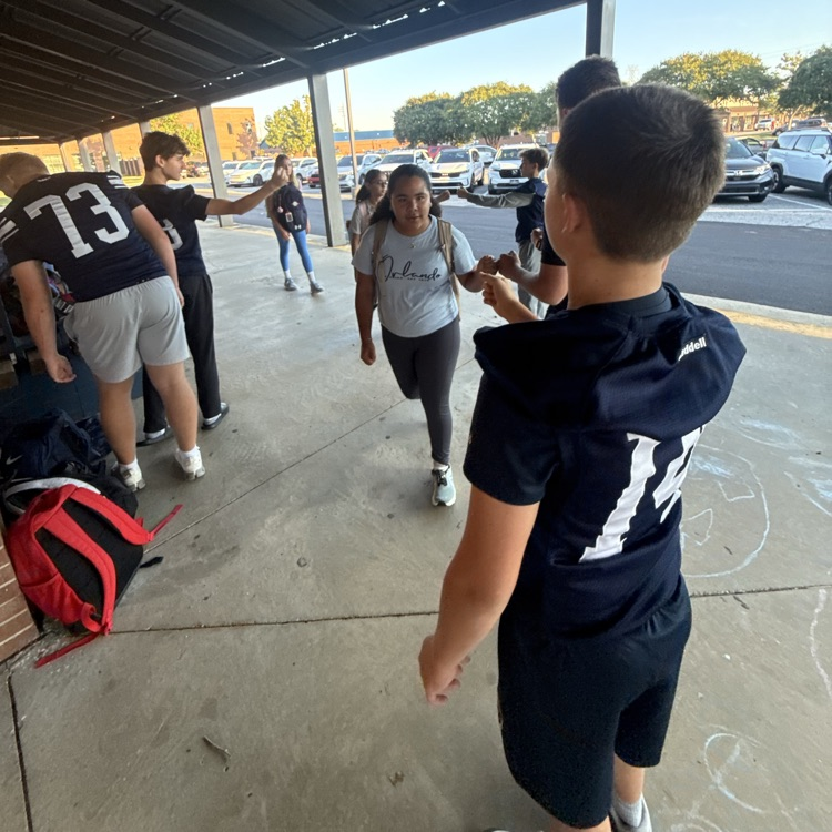 football players fist bumping 